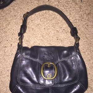 Small black coach shoulder bag.